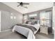 Cozy bedroom featuring neutral colors, a ceiling fan, and stylish decor at 6939 S Red Hills Rd, Gold Canyon, AZ 85118