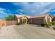 Charming single-story home with a well-manicured yard, tile roof, and a spacious driveway at 6939 S Red Hills Rd, Gold Canyon, AZ 85118