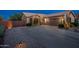 Charming single-story home with desert landscaping, a paved driveway, and a two-car garage. Ideal for suburban living at 6939 S Red Hills Rd, Gold Canyon, AZ 85118