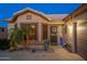 Charming single-story home with desert landscaping, a welcoming entrance, and a well-maintained facade at 6939 S Red Hills Rd, Gold Canyon, AZ 85118