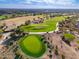 High-angle shot of lush green golf course tee box, set against a desert landscape at 6939 S Red Hills Rd, Gold Canyon, AZ 85118
