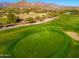 Overhead picture of a golf course green and bunker with picturesque mountain views at 6939 S Red Hills Rd, Gold Canyon, AZ 85118