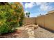 Backyard with fire pit, rock landscaping, privacy wall, and mature landscaping at 713 W Boxelder Pl, Chandler, AZ 85225