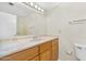 Bathroom with a large mirror, single sink with a marble countertop, and toilet at 713 W Boxelder Pl, Chandler, AZ 85225