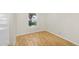 Bedroom with neutral walls, laminate flooring, and a sunlit window at 713 W Boxelder Pl, Chandler, AZ 85225
