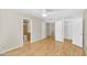 Bedroom featuring wood laminate flooring, a ceiling fan, and ensuite bathroom at 713 W Boxelder Pl, Chandler, AZ 85225