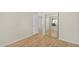 Bedroom with wood laminate flooring, a closet, and natural light at 713 W Boxelder Pl, Chandler, AZ 85225