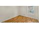 Bedroom with laminate flooring, neutral walls, and a window with natural light at 713 W Boxelder Pl, Chandler, AZ 85225