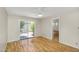 Bedroom with wood laminate flooring, ceiling fan, patio access and bathroom at 713 W Boxelder Pl, Chandler, AZ 85225
