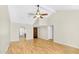 Bright living room with vaulted ceilings, wood-look floors, and views into the kitchen and entryway at 713 W Boxelder Pl, Chandler, AZ 85225
