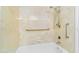 Shower stall with marbled walls and a built-in shower head and grab bar at 713 W Boxelder Pl, Chandler, AZ 85225