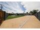 Expansive backyard featuring gravel, artificial grass, and secure fencing, creating a private outdoor oasis at 7201 N 16Th Dr, Phoenix, AZ 85021