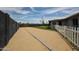 Spacious backyard with gravel, artificial grass, and a white picket fence, perfect for outdoor activities at 7201 N 16Th Dr, Phoenix, AZ 85021