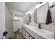 Bathroom featuring double sinks, modern lighting and stylish mirror at 7201 N 16Th Dr, Phoenix, AZ 85021