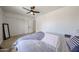 Cozy bedroom featuring neutral carpet, ceiling fan and closet with sliding doors at 7201 N 16Th Dr, Phoenix, AZ 85021