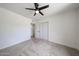 Bedroom featuring neutral carpet, ceiling fan and closet with sliding doors at 7201 N 16Th Dr, Phoenix, AZ 85021