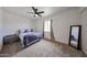 Bedroom with neutral carpet, ceiling fan and window with lots of natural light at 7201 N 16Th Dr, Phoenix, AZ 85021