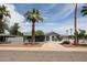 Beautiful single-story home with desert landscaping and a long, circular driveway at 7201 N 16Th Dr, Phoenix, AZ 85021