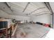 Spacious garage with ample room for storage, featuring a clean, open layout and overhead lighting at 7201 N 16Th Dr, Phoenix, AZ 85021