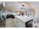 Open kitchen with island, farm sink, stainless appliances and bar stool seating at 7201 N 16Th Dr, Phoenix, AZ 85021