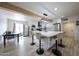 Bright, modern kitchen with a large center island, stainless steel appliances, and wood-look flooring at 7201 N 16Th Dr, Phoenix, AZ 85021