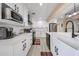 Bright kitchen featuring new stainless steel appliances, farm sink and quartz counters at 7201 N 16Th Dr, Phoenix, AZ 85021
