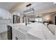 Open kitchen with farm sink, stainless appliances, island and bar stool seating at 7201 N 16Th Dr, Phoenix, AZ 85021
