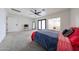 Spacious main bedroom with carpet flooring, ceiling fan and access to outdoor patio at 7201 N 16Th Dr, Phoenix, AZ 85021