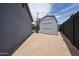 Practical backyard shed on a concrete slab, offering additional storage and organization space at 7201 N 16Th Dr, Phoenix, AZ 85021