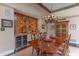 Dining area featuring a wet bar with wine storage and decorative tile backsplash at 7302 E Rose Ln, Scottsdale, AZ 85250