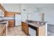 Well-lit kitchen featuring stainless steel appliances, tile flooring, and ample counter space at 7344 E Flower Ave, Mesa, AZ 85208