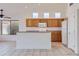 Bright kitchen with stainless steel appliances, breakfast bar, and tiled floors at 7344 E Flower Ave, Mesa, AZ 85208