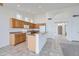 Bright kitchen with stainless steel appliances, breakfast bar, and tiled floors at 7344 E Flower Ave, Mesa, AZ 85208