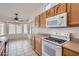 Bright kitchen with stainless steel appliances, breakfast bar, and tiled floors at 7344 E Flower Ave, Mesa, AZ 85208