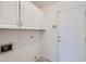 Laundry room with overhead cabinets at 7344 E Flower Ave, Mesa, AZ 85208