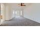 Carpeted living room featuring an archway leading to another room and ample space at 7344 E Flower Ave, Mesa, AZ 85208