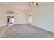 Bright living room with carpet, archways, and a decorative chandelier at 7344 E Flower Ave, Mesa, AZ 85208
