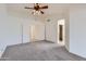 Large main bedroom features an arched entrance to main bath, new carpet and ample space at 7344 E Flower Ave, Mesa, AZ 85208