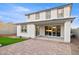Back of house featuring a covered patio and brick paver patio with mountain views at 7392 W Buckhorn Trl, Peoria, AZ 85383