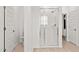 Bright bathroom features a glass shower stall, a toilet and light tile floor at 7392 W Buckhorn Trl, Peoria, AZ 85383