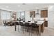 Bright open kitchen features a large island with seating and stainless steel appliances at 7392 W Buckhorn Trl, Peoria, AZ 85383