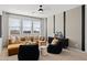 Bright living room with comfortable seating, large windows, and contemporary decor at 7392 W Buckhorn Trl, Peoria, AZ 85383