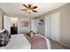 Comfortable bedroom with ample closet space, a ceiling fan, and relaxing decor at 811 E Eugie Ave, Phoenix, AZ 85022