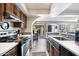 Bright kitchen features stainless steel appliances, a stove, and ample counter space, perfect for cooking at 811 E Eugie Ave, Phoenix, AZ 85022