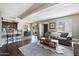 Open-concept living room featuring modern furnishings, hardwood floors, and lots of natural light at 811 E Eugie Ave, Phoenix, AZ 85022