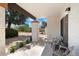 Relaxing outdoor patio with comfortable seating and views of the lush, landscaped backyard at 811 E Eugie Ave, Phoenix, AZ 85022