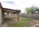 Backyard view showcasing a covered patio and block fence at 8334 N 55Th Ave, Glendale, AZ 85302
