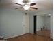 The bedroom features a mirrored closet, neutral paint, and a ceiling fan at 8334 N 55Th Ave, Glendale, AZ 85302
