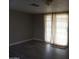 The bonus room features light-colored floors and a glass slider to the backyard at 8334 N 55Th Ave, Glendale, AZ 85302