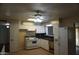 Bright kitchen featuring white cabinets, black countertops, and standard white appliances at 8334 N 55Th Ave, Glendale, AZ 85302